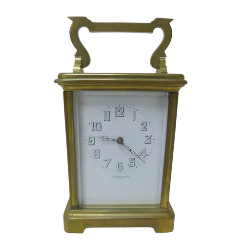 125 - A small brass carriage clock by JAS Ritchie & Son of Edinburgh, with Arabic numeral dial, with key, ... 