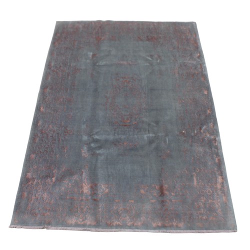 407 - A Shiraz rug, on grey ground with salmon pink highlights, 235 by 117cm.