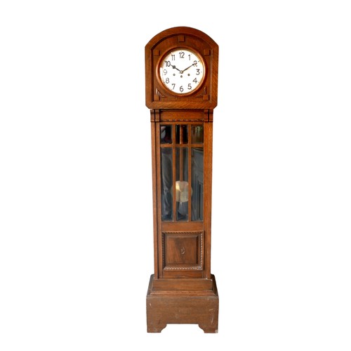 A mid 20th century Junghans oak longcase clock silvered dial with