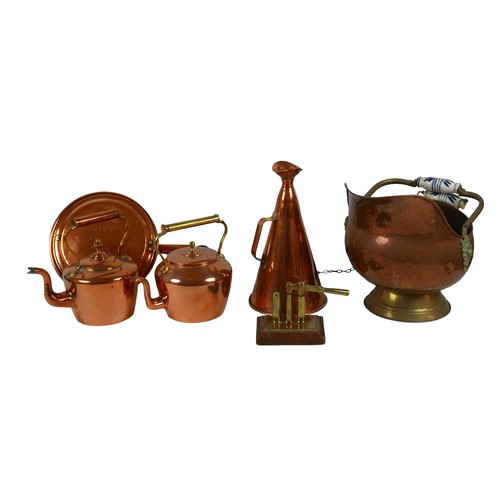 79 - A group of copper items, including a handheld megaphone, 19.5 by 35cm, two kettles, coal scuttle, wa... 