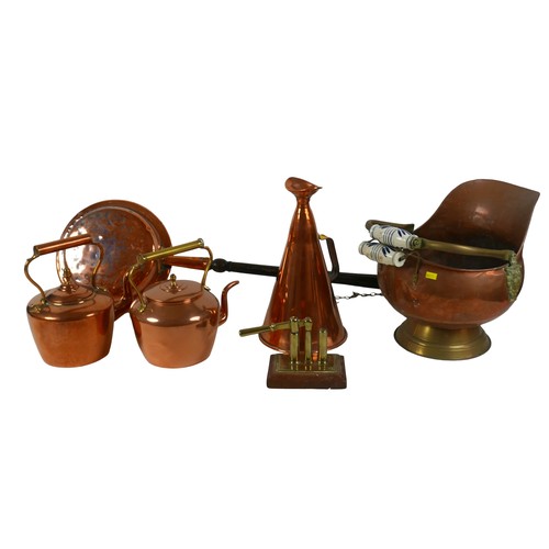 79 - A group of copper items, including a handheld megaphone, 19.5 by 35cm, two kettles, coal scuttle, wa... 