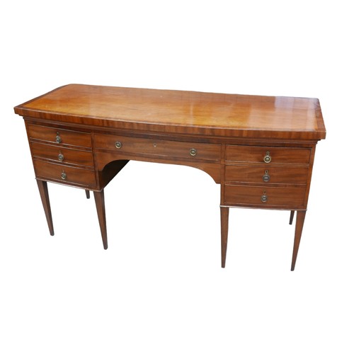 389 - A George III mahogany bow fronted sideboard, with seven drawers each with brass ring handles, raised... 