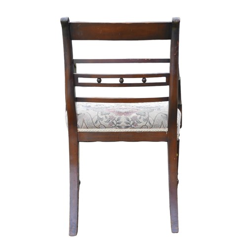 391A - A set of eight Regency bar back dining chairs including two carvers, with upholstered seats, raised ... 