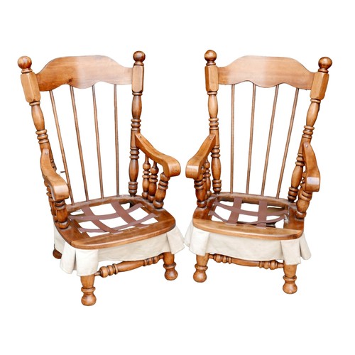 368 - A pair of American Lenoir Chair Company rocking armchairs, in Spanish Colonial style, each 65 by 79 ... 