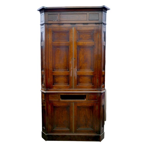 403 - A Georgian oak corner cupboard, in two sections, inlaid ebony detail to the frieze, with brass trim ... 