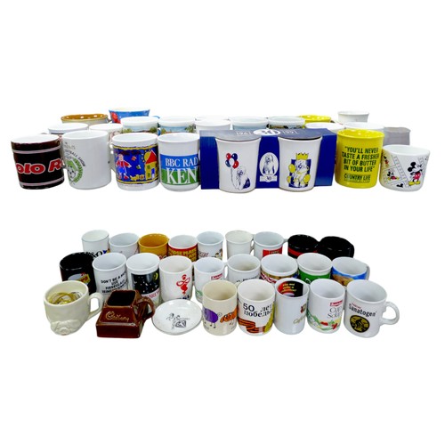 91 - A large quantity of assorted branded tins and mugs. (q)