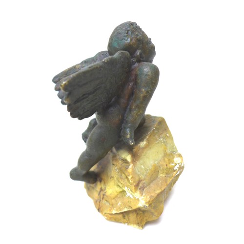 6 - Giuseppe Renda (Italian, 1859-1939): 'Flying Angel', a bronze sculpture, signed 'G Renda', on a natu... 