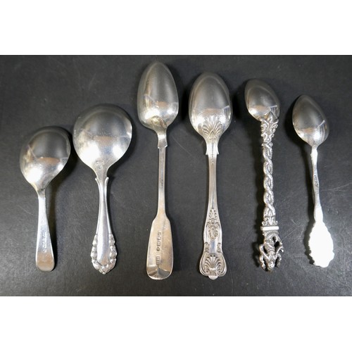 27 - A collection of silver items, comprising various spoons, three silver topped cut glass dressing tabl... 