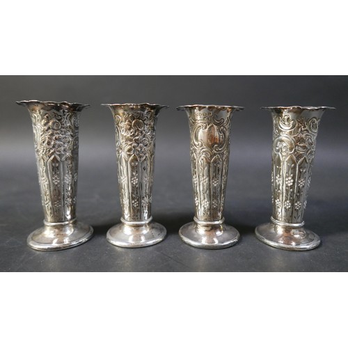 53 - A group of silver items, a group of four matching spill vases, 9.5cm high, salts, napkin rings and a... 