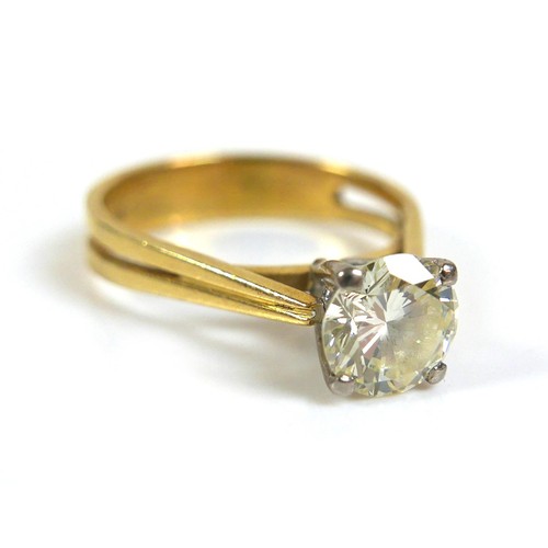 357 - An 18ct gold 1.55ct diamond solitaire ring, the round faceted cut stone, 7.6 by 4.5mm, in four claw ... 