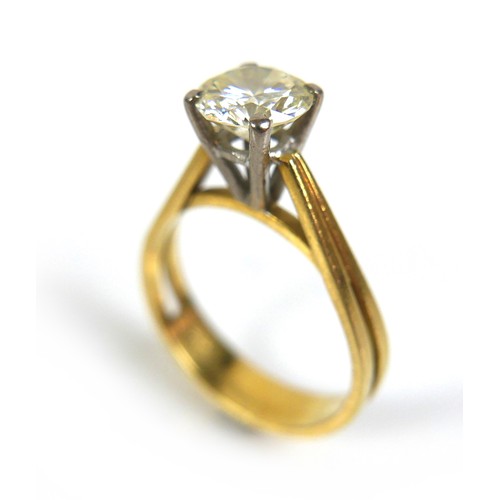 357 - An 18ct gold 1.55ct diamond solitaire ring, the round faceted cut stone, 7.6 by 4.5mm, in four claw ... 