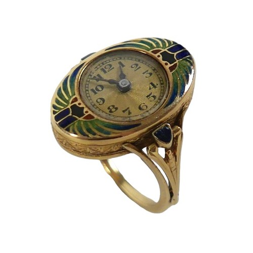 An Art Deco Egyptian Revival 18ct yellow gold and enamelled ring watch, the circular gilt guilloche dial with black Arabic numerals and minute track, blued steel hands, clasped by an opposing pair of stylised scarab beetles with outstretched wings forming an oval of the case, decorated with graduating blue, green and red coloured enamel, the crown with delicate crank style handle folding into the design of one shoulder with further blue triangular enamel decoration, an engraved band circles the case sides, 17 jewels movement, signed 'Abra Watch Co Suisse', case stamped 18ct and 'J✶W',  Glasgow Import 1924, case numbered '4003', size N, 9.0g, band 1.6mm, dial 11mm, oval head 20.5 by 13.5 by 6.0mm thick, 22 by 25mm outside measurements.
Notes: not in running condition, winds and hand set well but once started it stops ticking after a few seconds, suspect full service required.