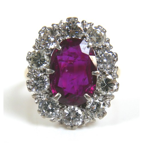 358 - A vintage yellow gold, ruby and diamond dress ring, the oval faceted cut ruby, approximately 2.5ct, ... 