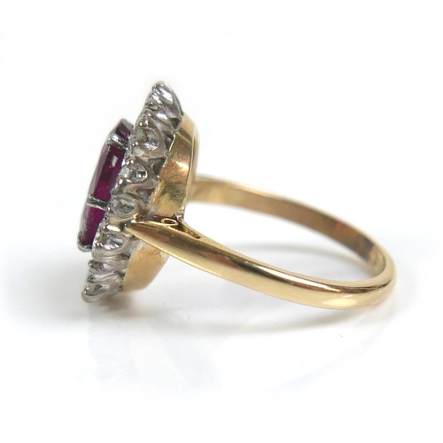 358 - A vintage yellow gold, ruby and diamond dress ring, the oval faceted cut ruby, approximately 2.5ct, ... 