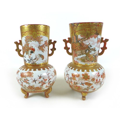 42 - A pair of Japanese Kutani vases, of baluster form, decorated in iron red and gilt, with cartouches o... 