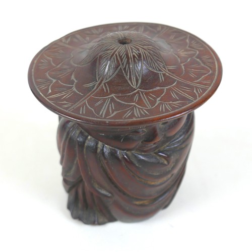 51 - An Oriental carved wooden lidded figure of a sleeping man, signed to base and top, 15cm wide by 16cm... 