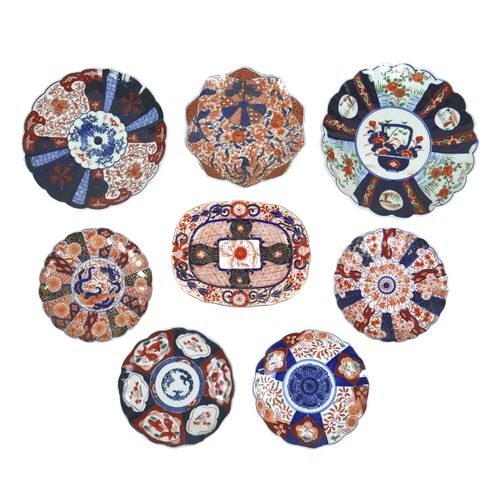 57 - A collection of seven Japanese Imari dishes and plates, together with a 19th century English Imari p... 