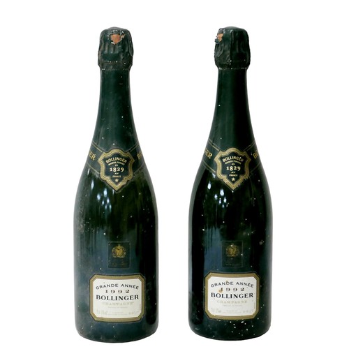 25 - Vintage Champagne: two bottles of 1992 Grande Annee Bollinger, slight damage to capsules, U: top of ... 