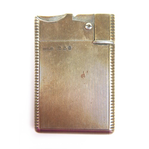 66 - An Asprey and co Ltd silver wafer petrol lighter, London 1953/54, 37 by 58 by 6mm.