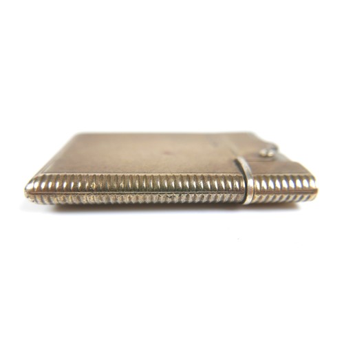 66 - An Asprey and co Ltd silver wafer petrol lighter, London 1953/54, 37 by 58 by 6mm.