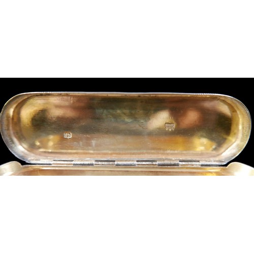 48 - A George III silver snuff box, of oblong form, bright cut decoration, hinged lid with parcel gilt in... 