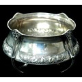 An Arts & Crafts silver bowl, with four handles, decorated with foliate designs, William Hair Hasele... 