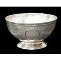 A George III sugar bowl, blank cartouches with repousse scroll and foliate decoration, rubbed hallma... 
