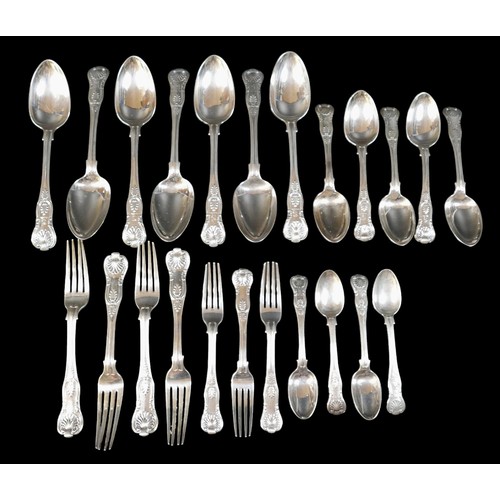 73 - A collection of William IV silver Kings pattern flatware, comprising seven table spoons, five desser... 