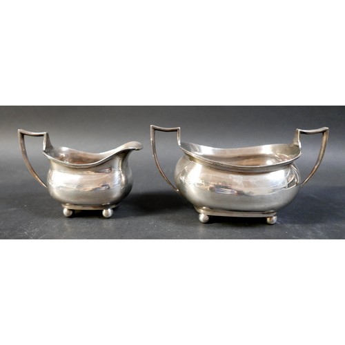 69 - A silver three piece tea set, comprising teapot, sugar bowl, and milk jug, Barker Brothers, Chester ... 