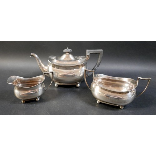 69 - A silver three piece tea set, comprising teapot, sugar bowl, and milk jug, Barker Brothers, Chester ... 