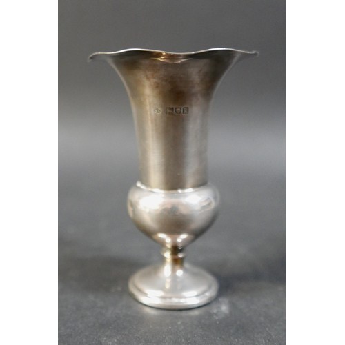 50 - A small collection of silver items, comprising two pairs of silver weighted vases, 16cm high, a sing... 