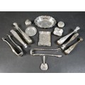 A collection of fourteen pieces of white metal/plated items, including seven sugar nips. (1 bag)