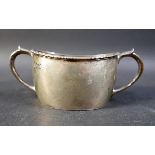 62 - A group of four silver items, comprising a milk jug, a sugar bowl, a tankard mustard with plated spo... 