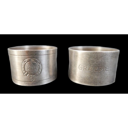 11 - A boxed set of six silver napkin rings, no engraving, together with two engraved silver napkin rings... 