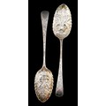 An associated pair of George III silver berry spoons, with blank cartouches, one rubbed maker's mark... 