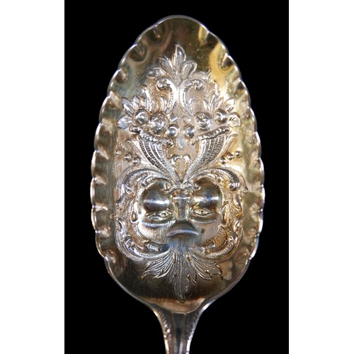 26 - An associated pair of George III silver berry spoons, with blank cartouches, one rubbed maker's mark... 