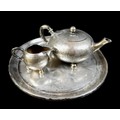 A German 800 grade silver three-piece part bachelor's tea set, fur effect decoration, comprising tea... 