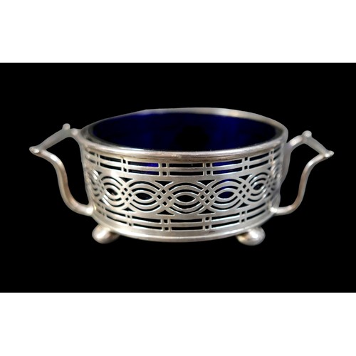 21 - A collection of Edwardian and later silver, including a twin handled sugar bowl with blue glass line... 