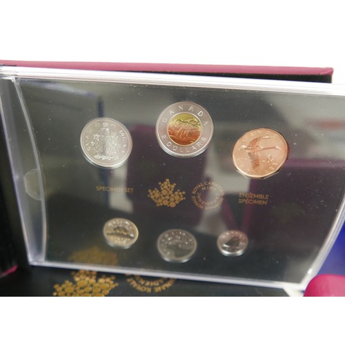 81 - A collection of thirteen Canadian silver coins, 227g total, together with two Canadian proof sets, a... 