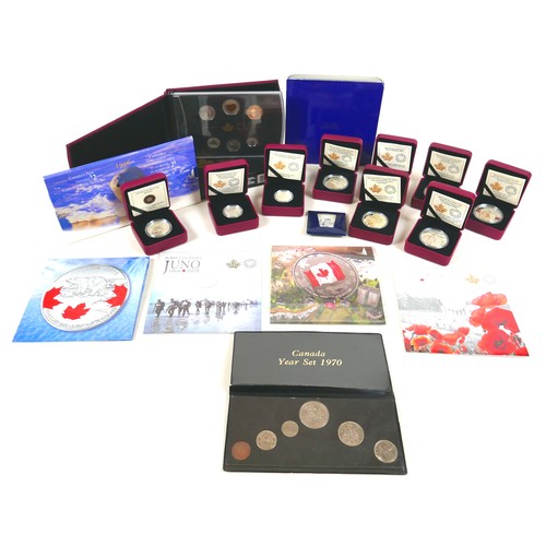 81 - A collection of thirteen Canadian silver coins, 227g total, together with two Canadian proof sets, a... 