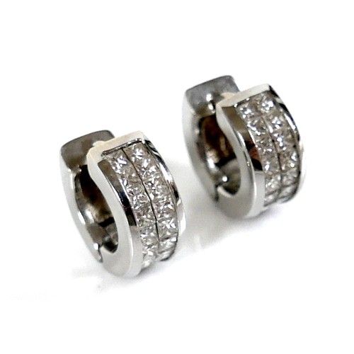 279 - A pair of white gold and diamond set hoop earrings, each pave set with eighteen 2.0mm princess cut d... 