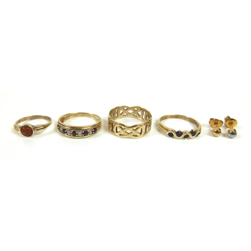 158 - A group of three 9ct yellow gold rings, one with pierced Celtic knot style design, 7.5mm wide, size ... 