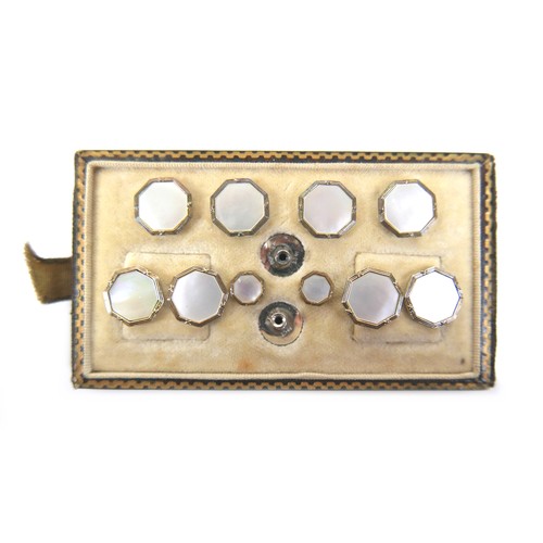 163 - A pair of 9ct yellow gold cufflinks, 4.8g, together with a silver stud waistcoat set. (1 bag)