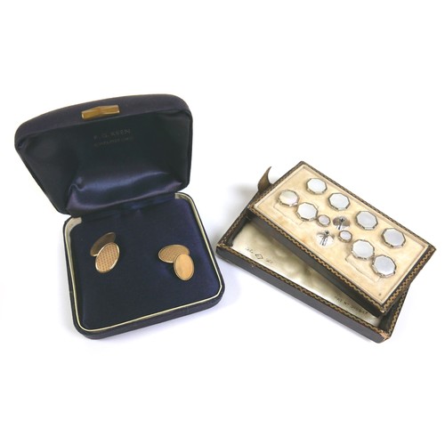 163 - A pair of 9ct yellow gold cufflinks, 4.8g, together with a silver stud waistcoat set. (1 bag)