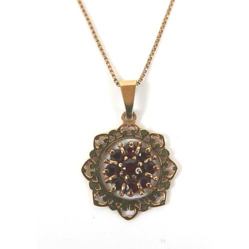 278 - A small collection of gold jewellery, including a pendant necklace with garnets, three gold rings, t... 