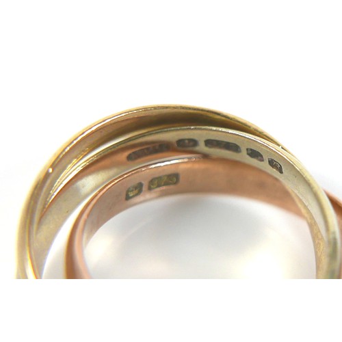 185 - A 9ct tri-colour gold 'Russian' style wedding ring, formed of three interlocking bands, size H, 4.2g... 