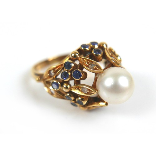 262 - An 18ct yellow gold dress ring, set with centrally with a pearl, 8mm, clasped by six slender leaves ... 