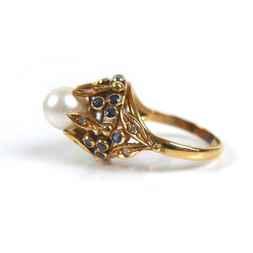 262 - An 18ct yellow gold dress ring, set with centrally with a pearl, 8mm, clasped by six slender leaves ... 