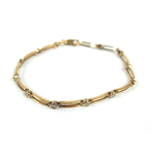 250 - A 9ct yellow gold bracelet, set with twelve 2.0mm brilliant cut diamonds in rub-over settings, joine... 