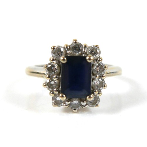 273 - An 18ct white gold sapphire and diamond ring, head 12 by 10mm, size I, 5.5g.